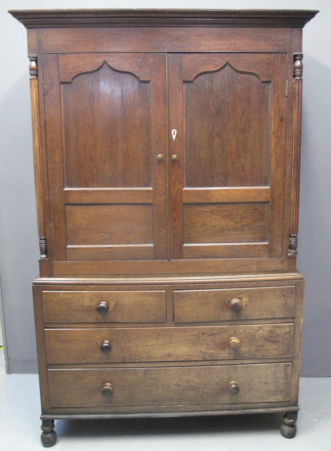 EARLY 19TH CENTURY WELSH OAK TWO STAGE PRESS CUPBOARD having moulded cornice above two ogee blind