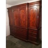 VICTORIAN MAHOGANY BREAK FRONT WARDROBE having moulded cornice above four blind panelled arch