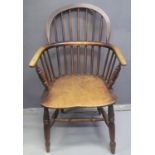 19TH CENTURY ASH AND ELM WINDSOR HOOP BACKED ELBOW CHAIR having moulded seat standing on baluster