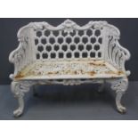 19TH CENTURY HEAVY CAST IRON TWO SEATER GARDEN BENCH having pierced decoration to the back, sides