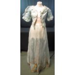 19TH CENTURY PALE BLUE BODICE AND SKIRT in a pale blue net fabric, bodice with silk and tulle edging