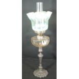 VICTORIAN DOUBLE OIL BURNER LAMP having clear glass chimney and green vaseline glass shade with