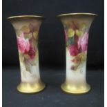 TWO SIMILAR ROYAL WORCESTER PORCELAIN TRUMPET VASES decorated with roses and foilage, signed by
