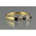 18CT GOLD SAPPHIRE AND DIAMOND HALF ETERNITY RING of two brilliant cut diamonds and three sapphires.