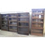 THREE EARLY 20TH CENTURY OAK GLOBE WERNICKE FOUR SECTIONAL BOOKCASES with copper banding and Globe