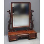 VICTORIAN MAHOGANY TOILET MIRROR of oval form flanked by two carved stylised dolphin supports, the