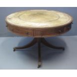 EARLY 20TH CENTURY MAHOGANY REVOLVING DRUM OR CENTRE TABLE of circular form with leather inset top