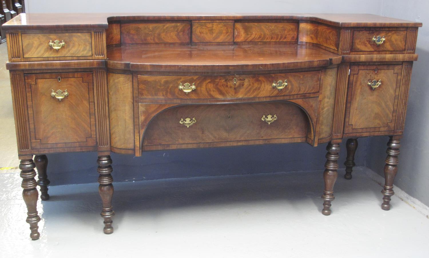 VICTORIAN SCOTTISH MAHOGANY BREAKFRONT SIDEBOARD having raised back with two blind cupboards