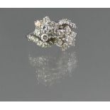 18CT WHITE GOLD DIAMOND DOUBLE CLUSTER RING set on a twist with diamond set shoulders. Ring size