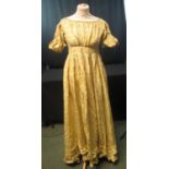 YELLOW SILK FLORAL EMBROIDERED ANTIQUE DRESS (possibly early 19th Century). (B.P. 21% + VAT)