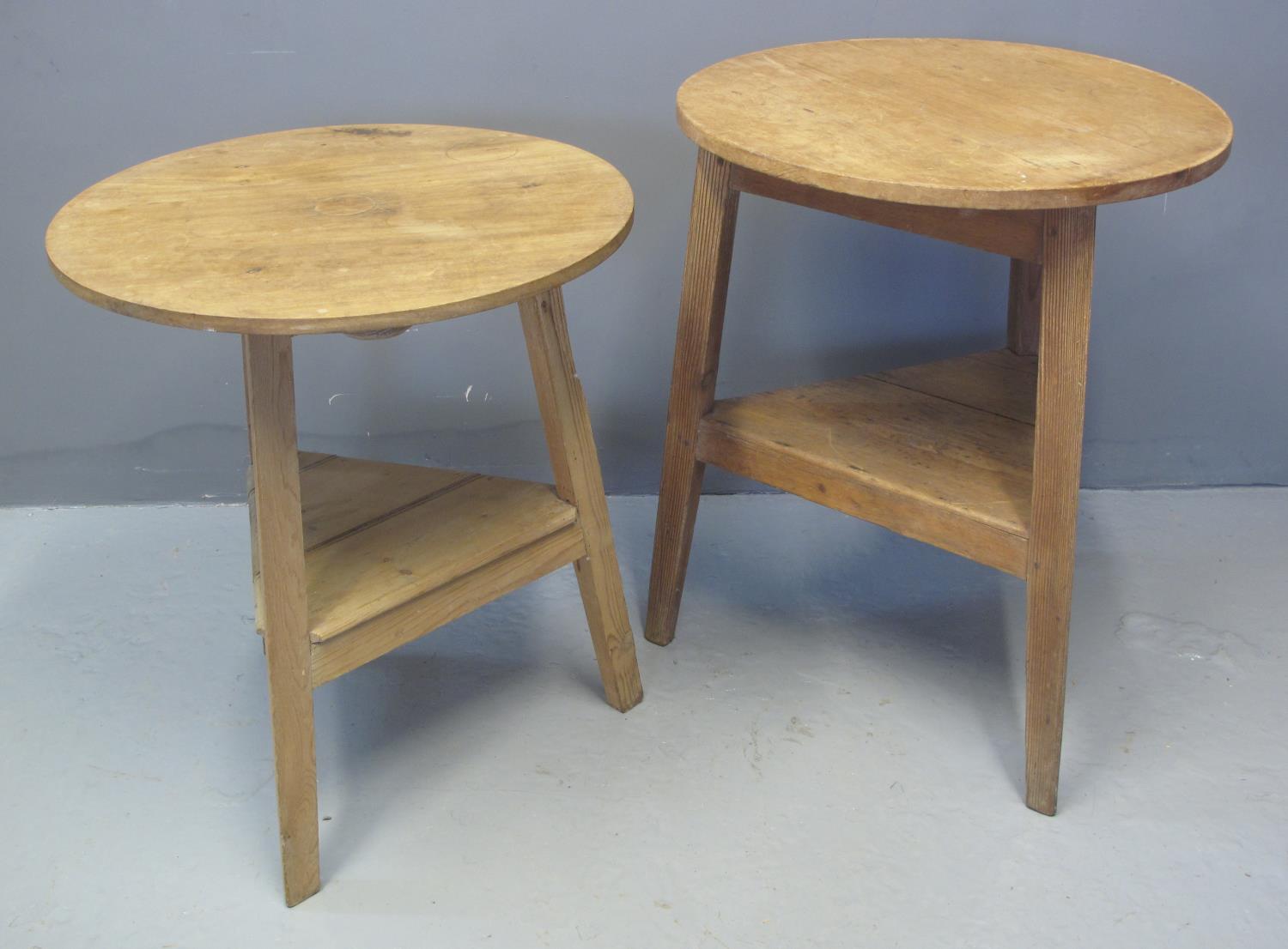 TWO TRADITIONAL WELSH PINE CRICKET TABLES with under tiers. 60cm diameter, 69cm high and 60cm