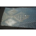 AN EARLY 20TH CENTURY ASSUIT EGYPTIAN SHAWL pale blue net with hammered silver geometric design. (