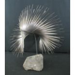 BERNARD ELLIS, modern steel sculpture, fan shaped feathers, on natural stone base. 57cm high approx.