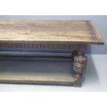 ELIZABETHAN STYLE OAK REFECTORY TABLE with cleated five plank top above arcade frieze, standing on