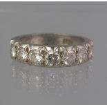 18CT WHITE GOLD SEVEN STONE DIAMOND RING in half eternity style. Ring size L. Weight 6.1g approx. (
