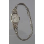 18CT WHITE GOLD LADIES ART DECO DESIGN SMALL HEAD COCKTAIL WATCH, the Art Deco design case set