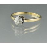 YELLOW METAL AND DIAMOND SOLITAIRE RING. The old cut diamond an estimated 0.45cts. Ring size N.