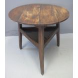 19TH CENTURY TRADITIONAL WELSH OAK CRICKET TABLE with under shelf. 74cm diameter, 70cm high