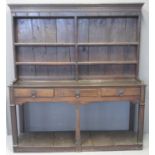 18TH CENTURY OAK TWO STAGE RACK BACK POT BOARD DRESSER having moulded cornice above 'missing' shaped