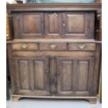 18TH CENTURY WELSH OAK DEUDDARN having moulded cornice flanked by two turned drop finials, two blind