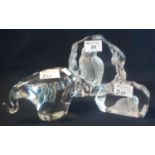 Heavy glass paperweight in the form of an elephant, together with two glass intaglios, one of an