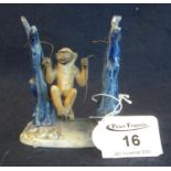 19th Century German porcelain figure of a monkey on a swing, impressed marks to base, 8cm high