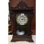 Early 20th Century American gingerbread type two train mantel clock. 56cm high approx. (B.P. 21% +
