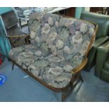 Ercol two seater upholstered sofa with spindle frame and original cushions. (B.P. 21% + VAT)