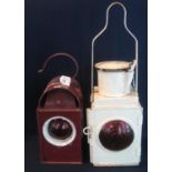 Large cream painted railwayman's lantern with fitted burner and reservoir, together with a red