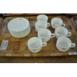 A set of seven Royal Doulton 'National Heir' fine bone china coffee cups and saucers, together