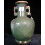 Heavily potted green glazed, Oriental style two handled, baluster shaped vase. 30cm high. (B.P.