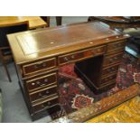 Reproduction mahogany knee hole desk having leather inset top above three drawers to each
