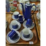 13 piece mid Century pottery coffee set on a blue and white ground with flower head decoration. (B.