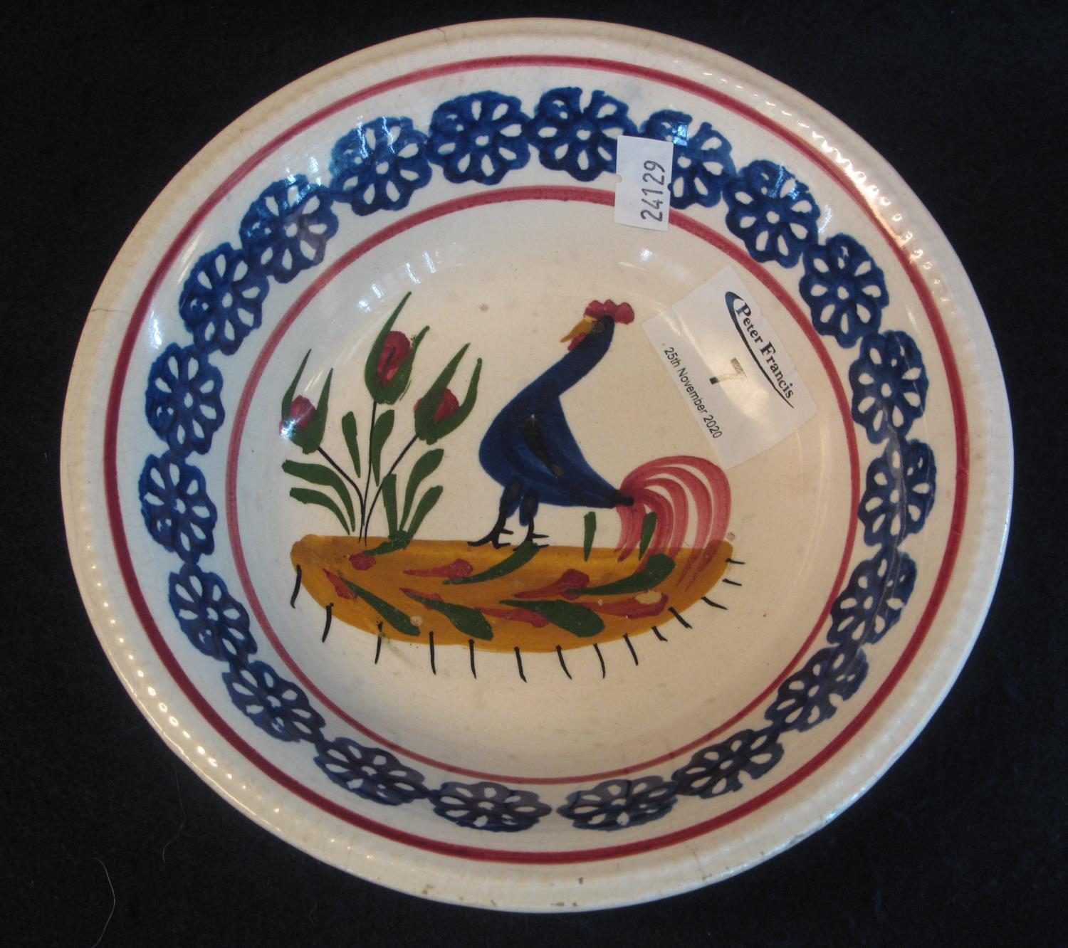 Llanelly pottery cockerel bowl with typical decoration within flower head border, unmarked, 18cm