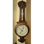 Early 20th Century carved walnut aneroid wheel barometer marked Barry & Sons. (B.P. 21% + VAT)