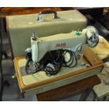 Alfa De Luxe sewing machine with fitted hood. (B.P. 21% + VAT)