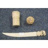 Indian ivory letter knife with carved elephant terminal, 21cm long approx and a Chinese ivory dice