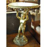 Modern gilt finish lamp table in the form of a cherub on naturalistic base with faux marble top. (