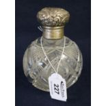 Cut glass large spherical scent bottle with repousse silver cover and inner stopper, London