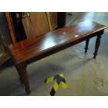 Victorian style mahogany side table of low form on turned legs. (B.P. 21% + VAT)