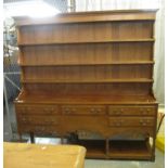 19th Century style oak rack back two stage pot board dresser having moulded cornice above three