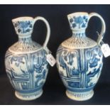 Two similar Japanese Arita porcelain baluster shaped wine jugs with loop handles, overall