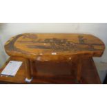 Mid Century rustic elm coffee table, the top carved with horse ploughing scenes. (B.P. 21% + VAT)