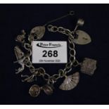Silver charm bracelet with various silver and white metal charms. (B.P. 21% + VAT)