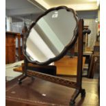 19th Century mahogany toilet or bedroom swivel mirror of cloud form. (B.P. 21% + VAT)