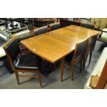 1960's teak dining table with a set of six matching dining chairs with leather finish backs and