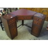 Heals of London oak corner desk, having leather inset top above a central drawer. (B.P. 21% + VAT)