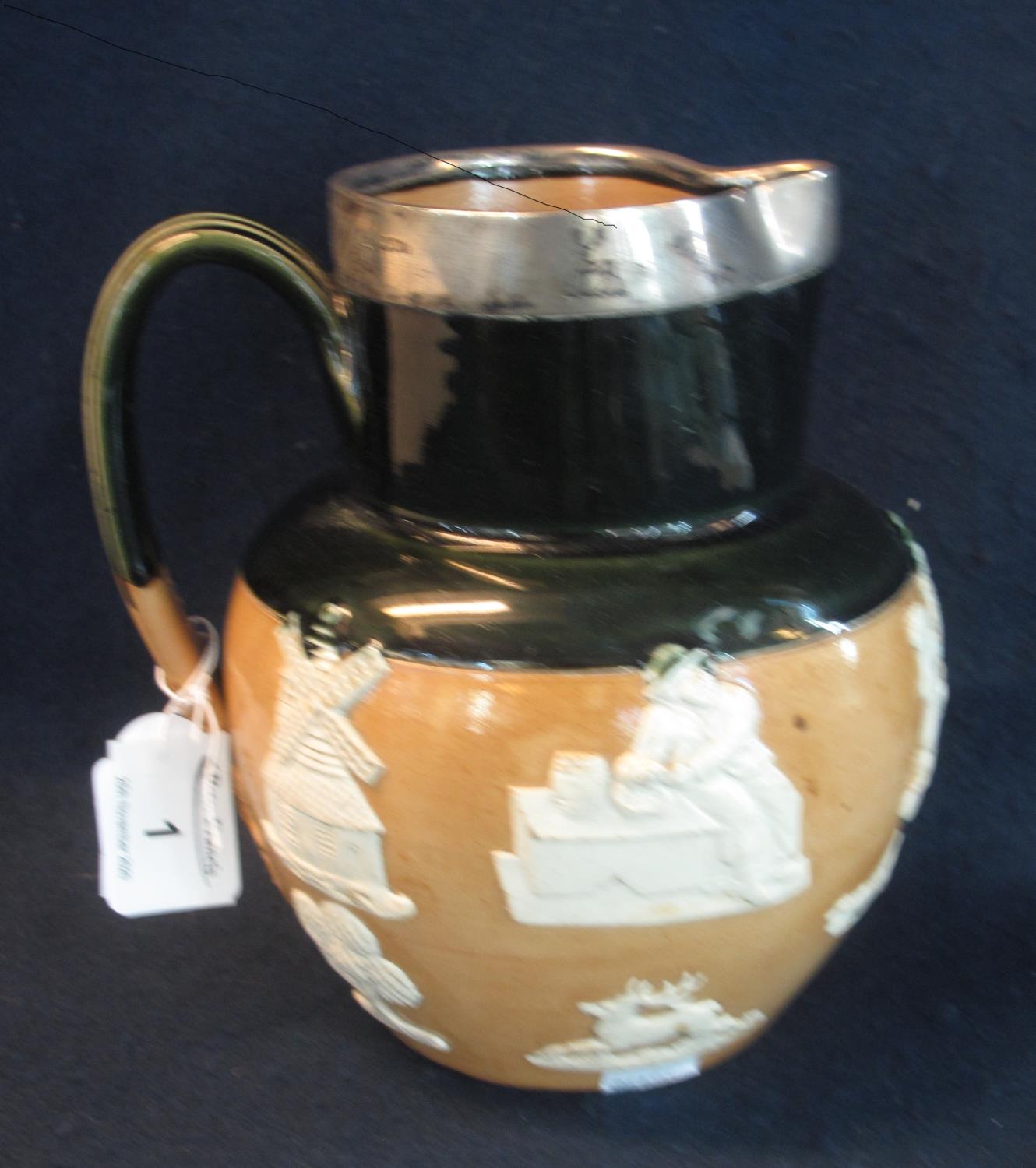 Late 19th Century Doulton Lambeth stoneware baluster shaped topers jug with silver rim, impressed