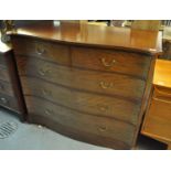 Edwardian mahogany inlaid serpentine chest of two short and three long drawers on a projected