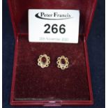 Pair of garnet set earrings. (B.P. 21% + VAT)